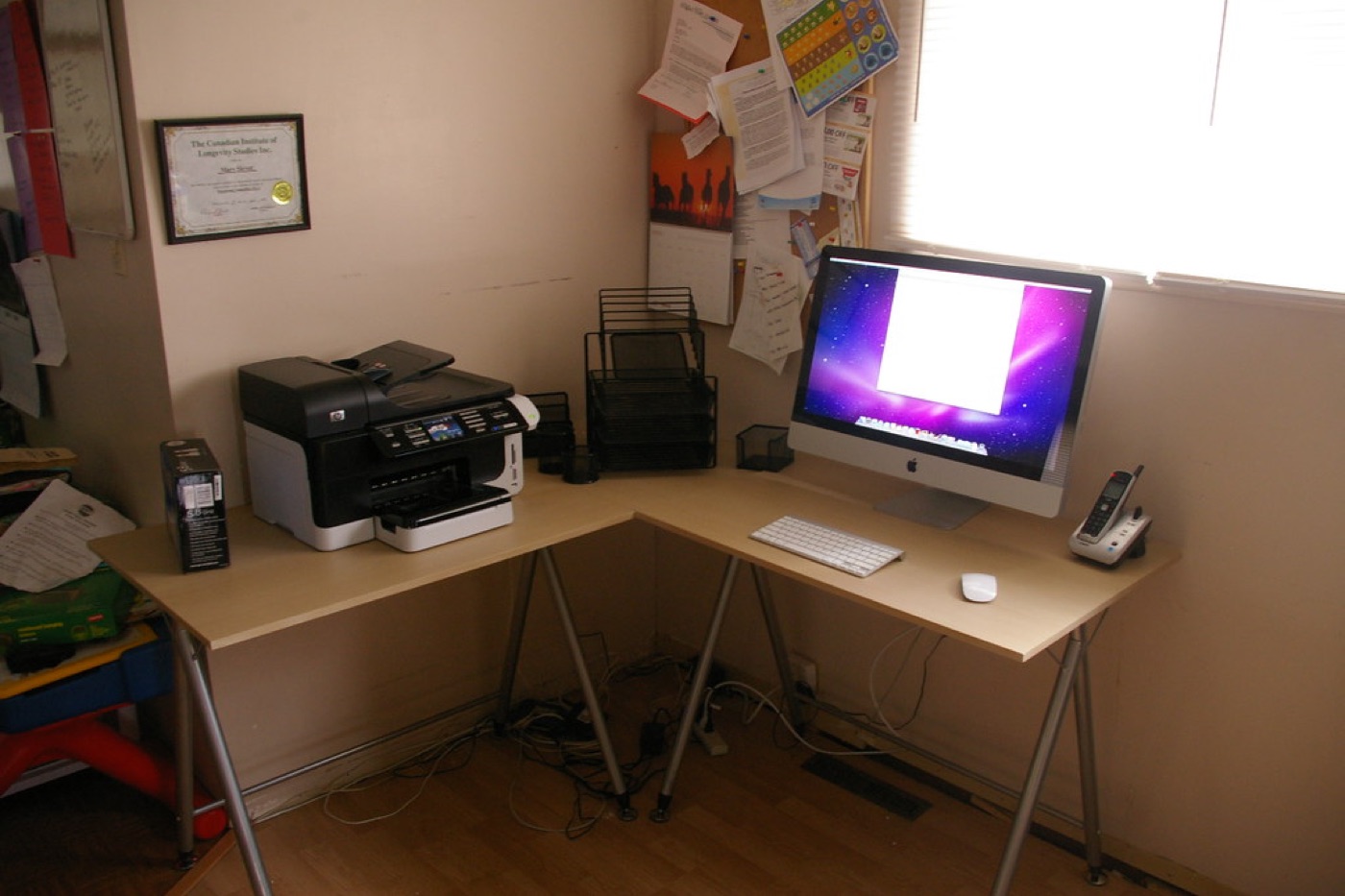 Freelancer working from a home office desk with a laptop